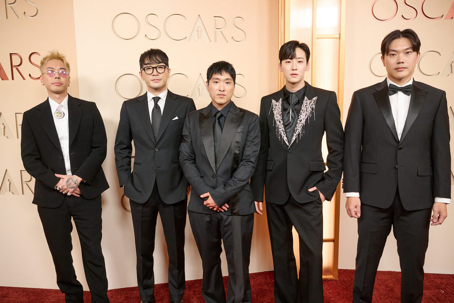 Danny Chung, Neckwav, Andrew Choi, Kevin Woo, and SamUIL Lee arrive on the red carpet of the 98th Oscars® at the Dolby® Theatre at Ovation Hollywood on Sunday, March 15, 2026.