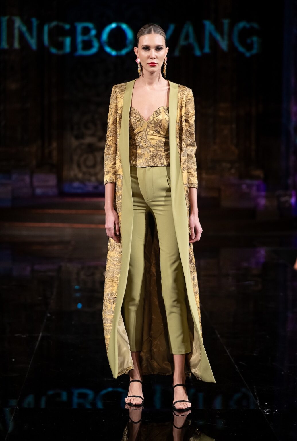 NEW YORK, NEW YORK - FEBRUARY 12: A model walks the runway at the Jingbo Yang show during New York Fashion Week Powered By Art Hearts Fashion at The Angel Orensanz Foundation on February 12, 2026 in New York City. (Photo by Mark Gunter/Getty Images for Art Hearts Fashion)