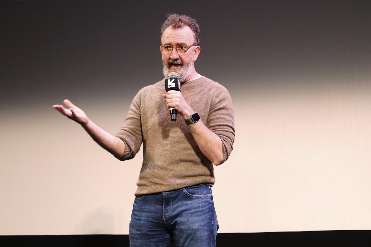 AUSTIN, TEXAS - MARCH 14: John Carney speaks onstage during the premiere of "Power Ballad" during SXSW at The Paramount Theatre on March 14, 2026 in Austin, Texas. (Photo by Robin Marchant/Getty Images for Lionsgate)