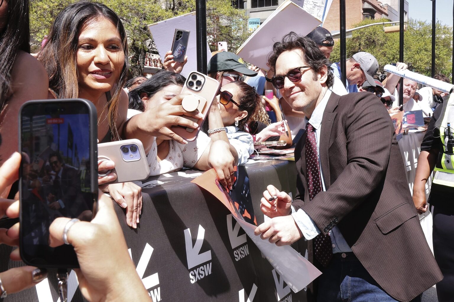 AUSTIN, TEXAS - MARCH 14: Paul Rudd greets fans during the premiere of "Power Ballad" during SXSW at The Paramount Theatre on March 14, 2026 in Austin, Texas. (Photo by Robin Marchant/Getty Images for Lionsgate)