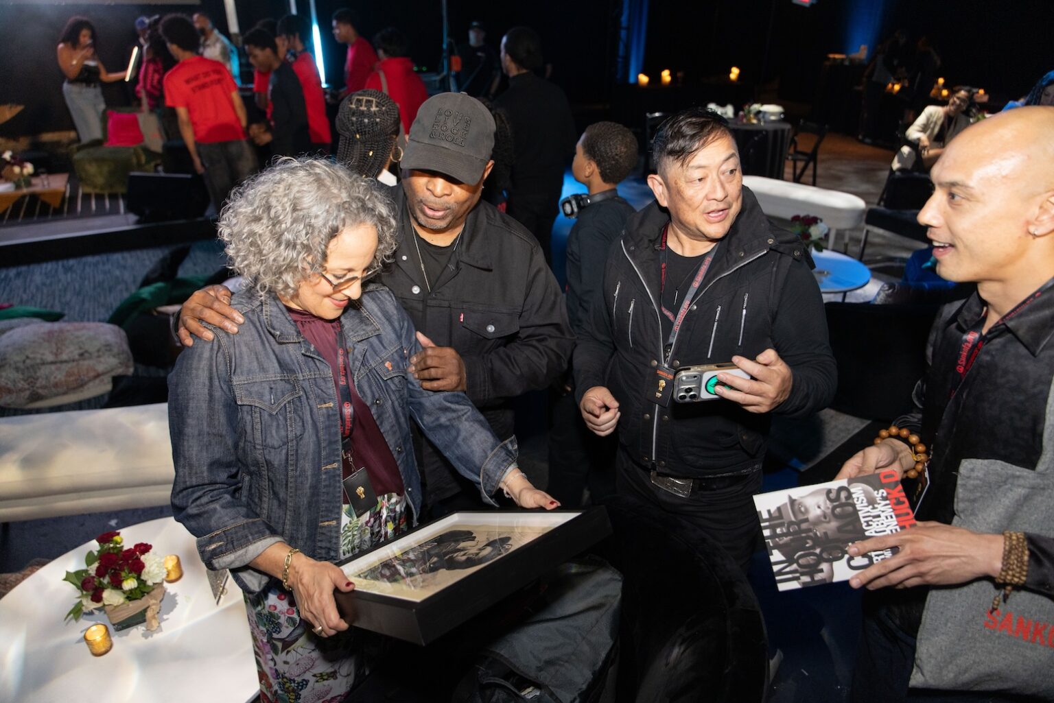 LOS ANGELES, CALIFORNIA - MARCH 1: Gina Belafonte and Chuck D review a framed portrait during the inaugural Sankofa.org Social Justice Awards at Chaplin Studios on March 1, 2026 in Los Angeles, California. (Photo by Todd Westphal / Sankofa.org)