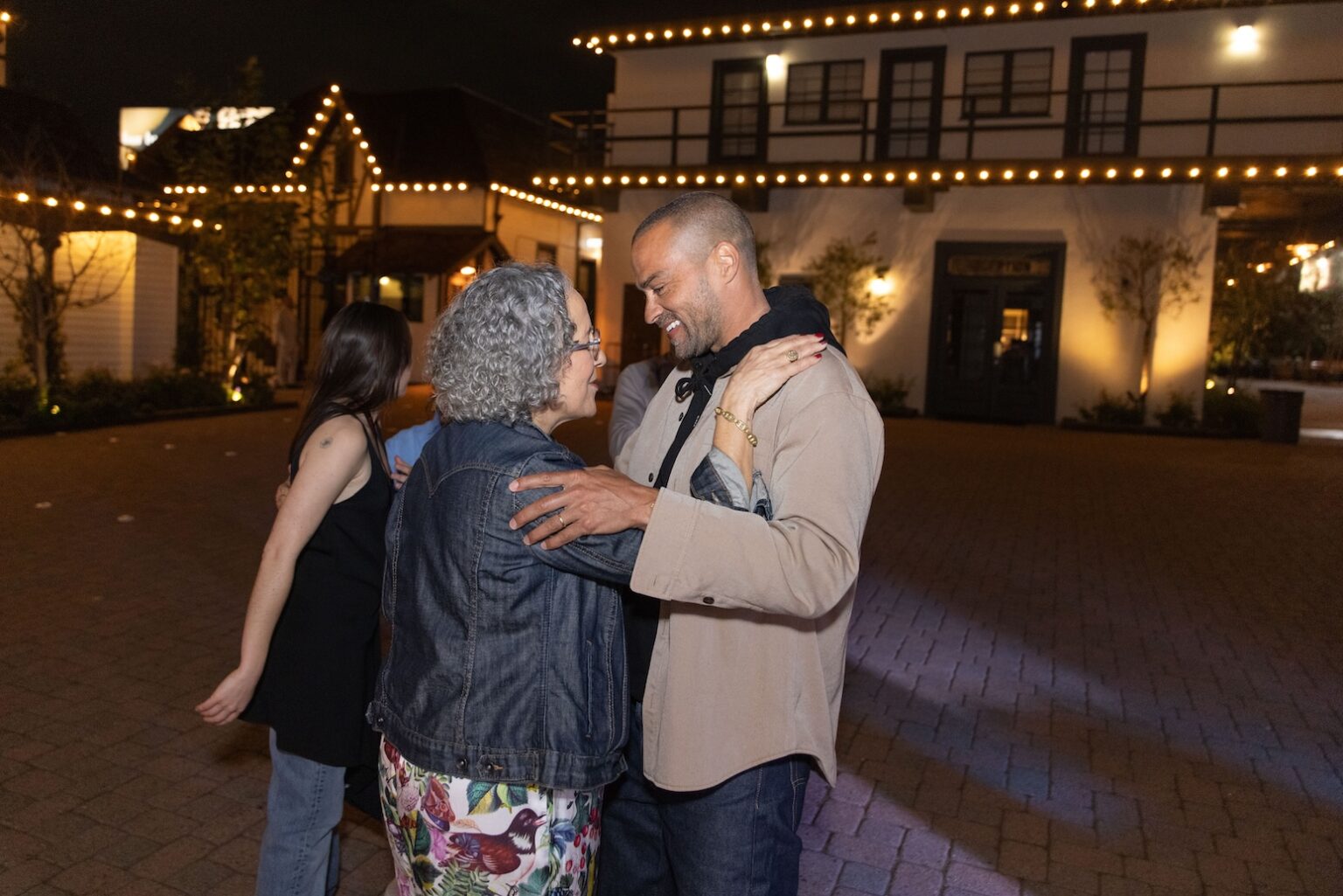 LOS ANGELES, CALIFORNIA - MARCH 1: Gina Belafonte embraces Jesse Williams outside Chaplin Studios during the inaugural Sankofa.org Social Justice Awards on March 1, 2026 in Los Angeles, California. (Photo by Todd Westphal / Sankofa.org)