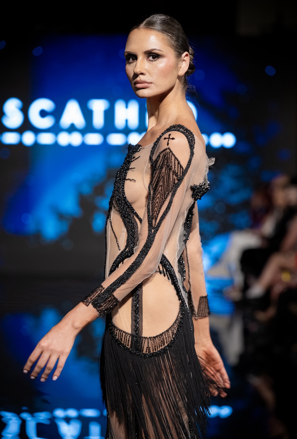 LOS ANGELES, CALIFORNIA - MARCH 13: A model walks the runway at the Scathed Fashion show during Los Angeles Fashion Week Powered By Art Hearts Fashion at The Majestic on March 13, 2026 in Los Angeles, California. (Photo by Mark Gunter/Getty Images for Art Hearts Fashion)