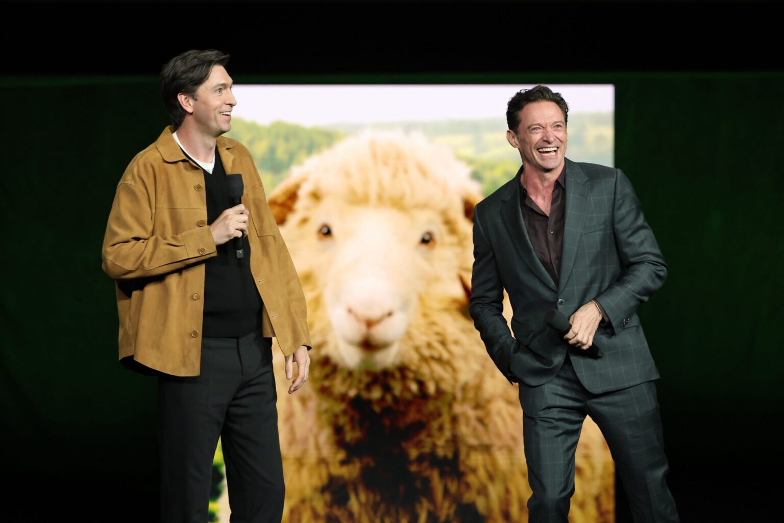 LAS VEGAS, NEVADA - APRIL 15: Nicholas Braun (L) and Hugh Jackman from "The Sheep Detectives" at the Amazon MGM Studios' CinemaCon 2026 Presentation at The Colosseum at Caesars Palace on April 15, 2026 in Las Vegas, Nevada. (Photo by Stewart Cook/Amazon MGM Studios via Getty Images)