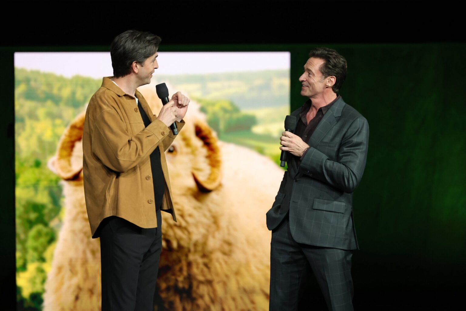 LAS VEGAS, NEVADA - APRIL 15: Nicholas Braun (L) and Hugh Jackman from "The Sheep Detectives" at the Amazon MGM Studios' CinemaCon 2026 Presentation at The Colosseum at Caesars Palace on April 15, 2026 in Las Vegas, Nevada. (Photo by Stewart Cook/Amazon MGM Studios via Getty Images)