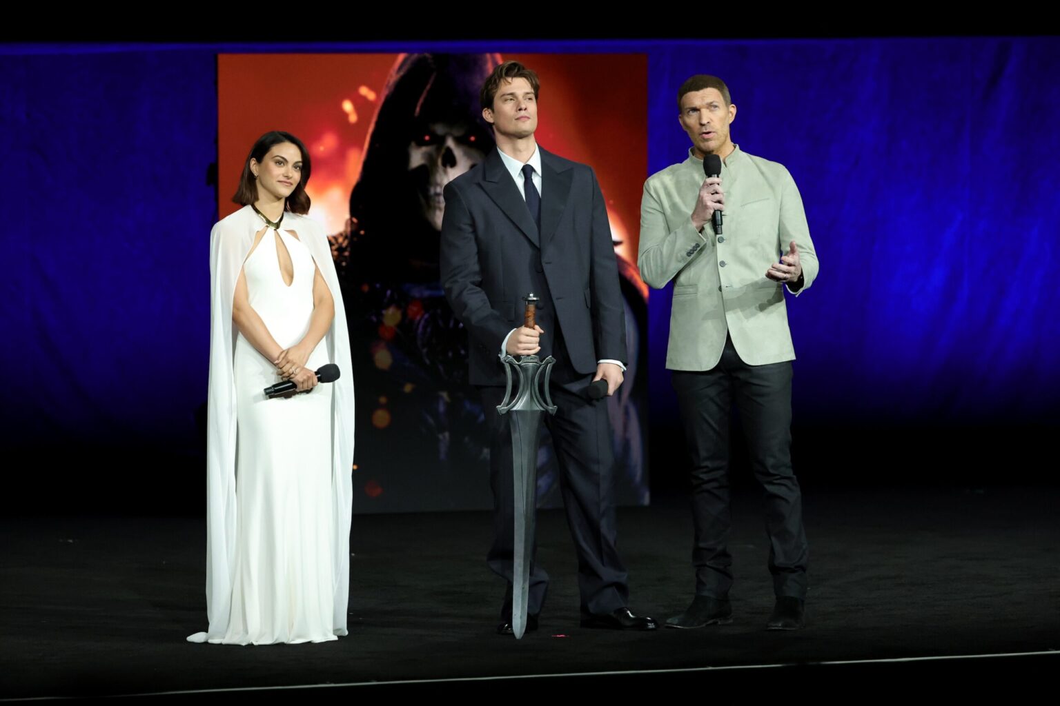LAS VEGAS, NEVADA - APRIL 15: (L-R) Camila Mendes, Nicholas Galitzine and Travis Knight from "Masters of the Universe" at the Amazon MGM Studios' CinemaCon 2026 Presentation at The Colosseum at Caesars Palace on April 15, 2026 in Las Vegas, Nevada. (Photo by Stewart Cook/Amazon MGM Studios via Getty Images)