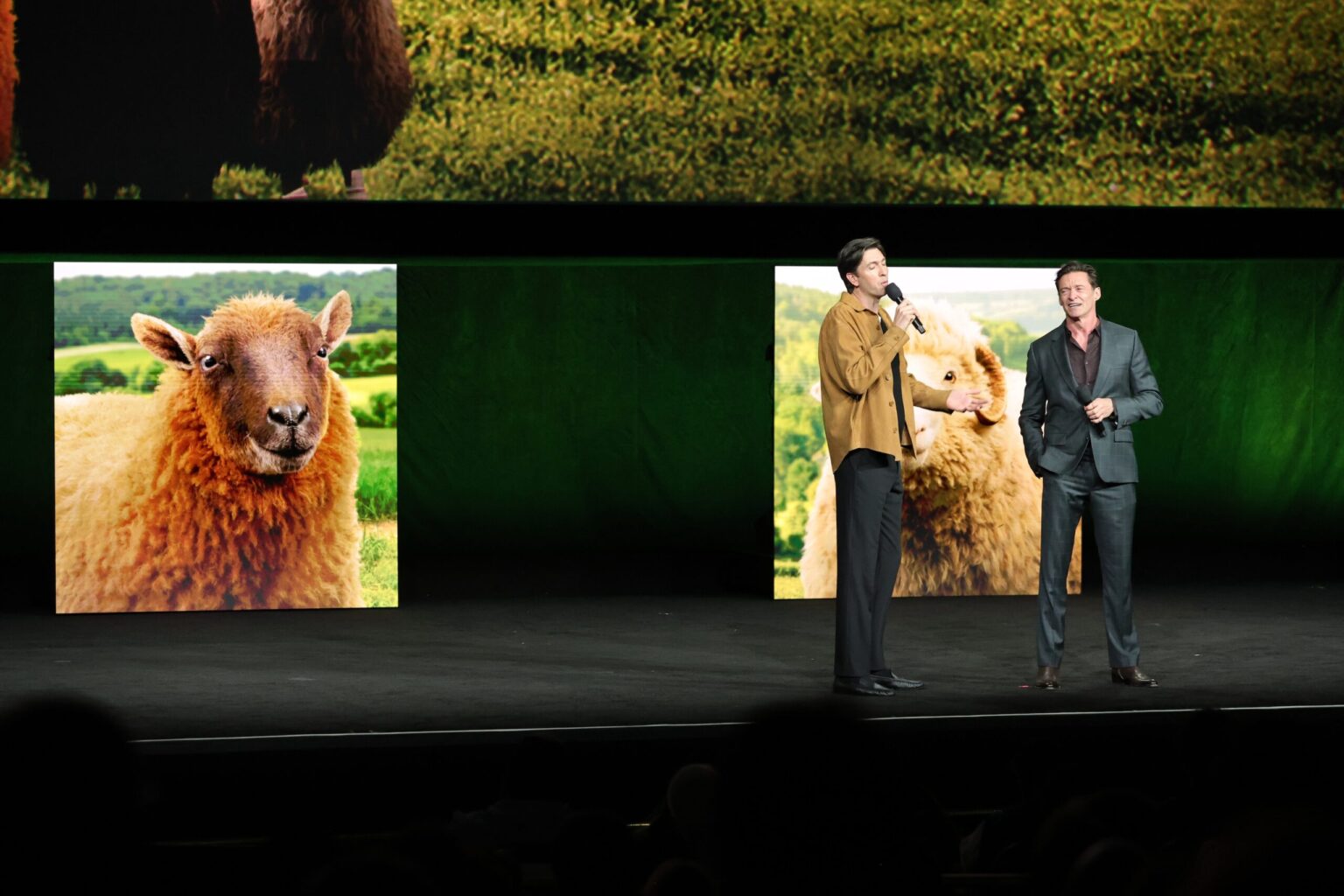 LAS VEGAS, NEVADA - APRIL 15: Nicholas Braun (L) and Hugh Jackman from "The Sheep Detectives" at the Amazon MGM Studios' CinemaCon 2026 Presentation at The Colosseum at Caesars Palace on April 15, 2026 in Las Vegas, Nevada. (Photo by Stewart Cook/Amazon MGM Studios via Getty Images)
