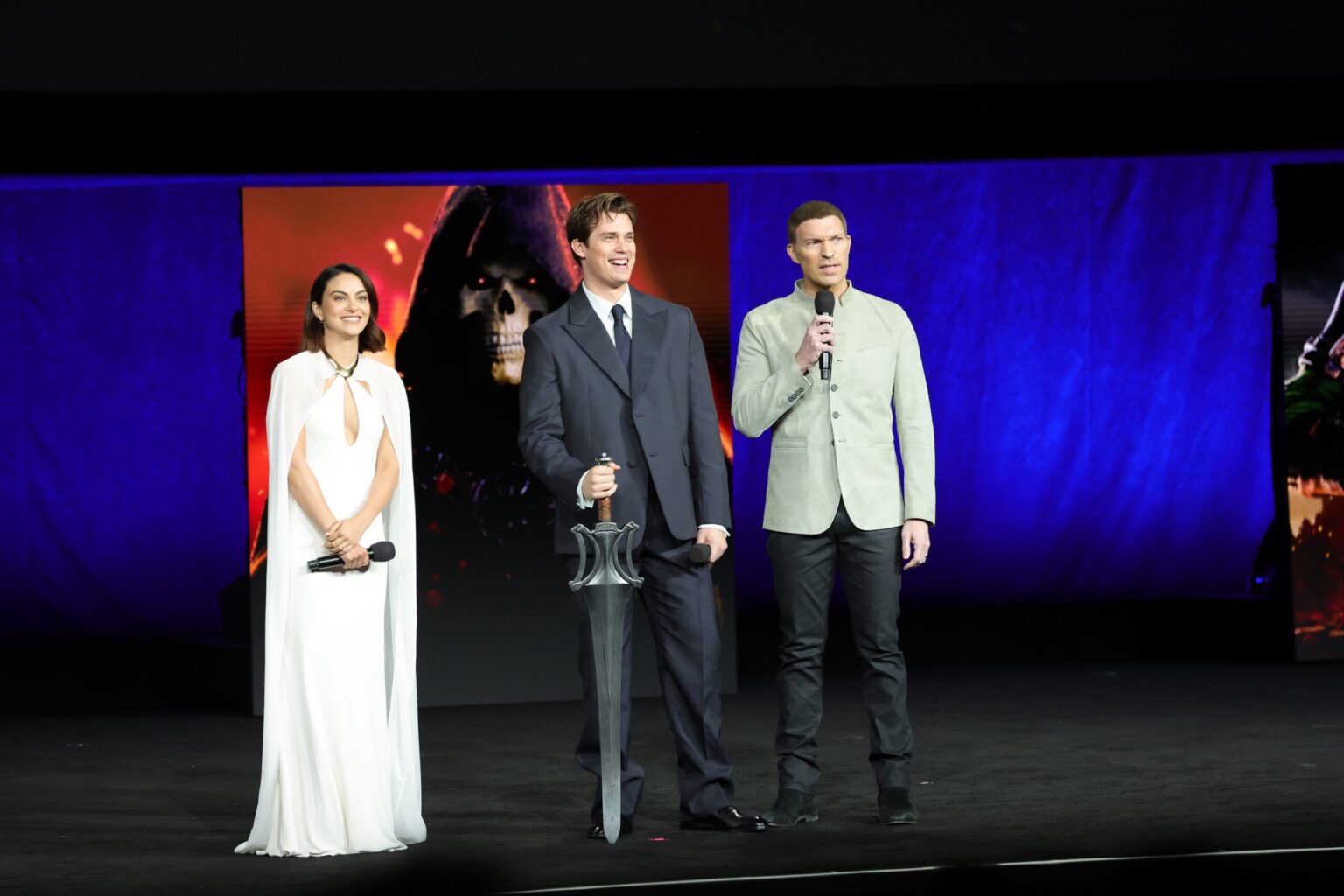 LAS VEGAS, NEVADA - APRIL 15: (L-R) Camila Mendes, Nicholas Galitzine and Travis Knight from "Masters of the Universe" at the Amazon MGM Studios' CinemaCon 2026 Presentation at The Colosseum at Caesars Palace on April 15, 2026 in Las Vegas, Nevada. (Photo by Stewart Cook/Amazon MGM Studios via Getty Images)