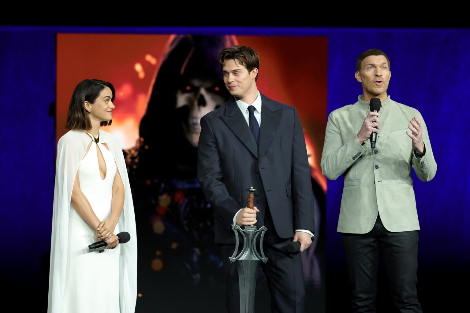 LAS VEGAS, NEVADA - APRIL 15: (L-R) Camila Mendes, Nicholas Galitzine and Travis Knight from "Masters of the Universe" at the Amazon MGM Studios' CinemaCon 2026 Presentation at The Colosseum at Caesars Palace on April 15, 2026 in Las Vegas, Nevada. (Photo by Stewart Cook/Amazon MGM Studios via Getty Images)