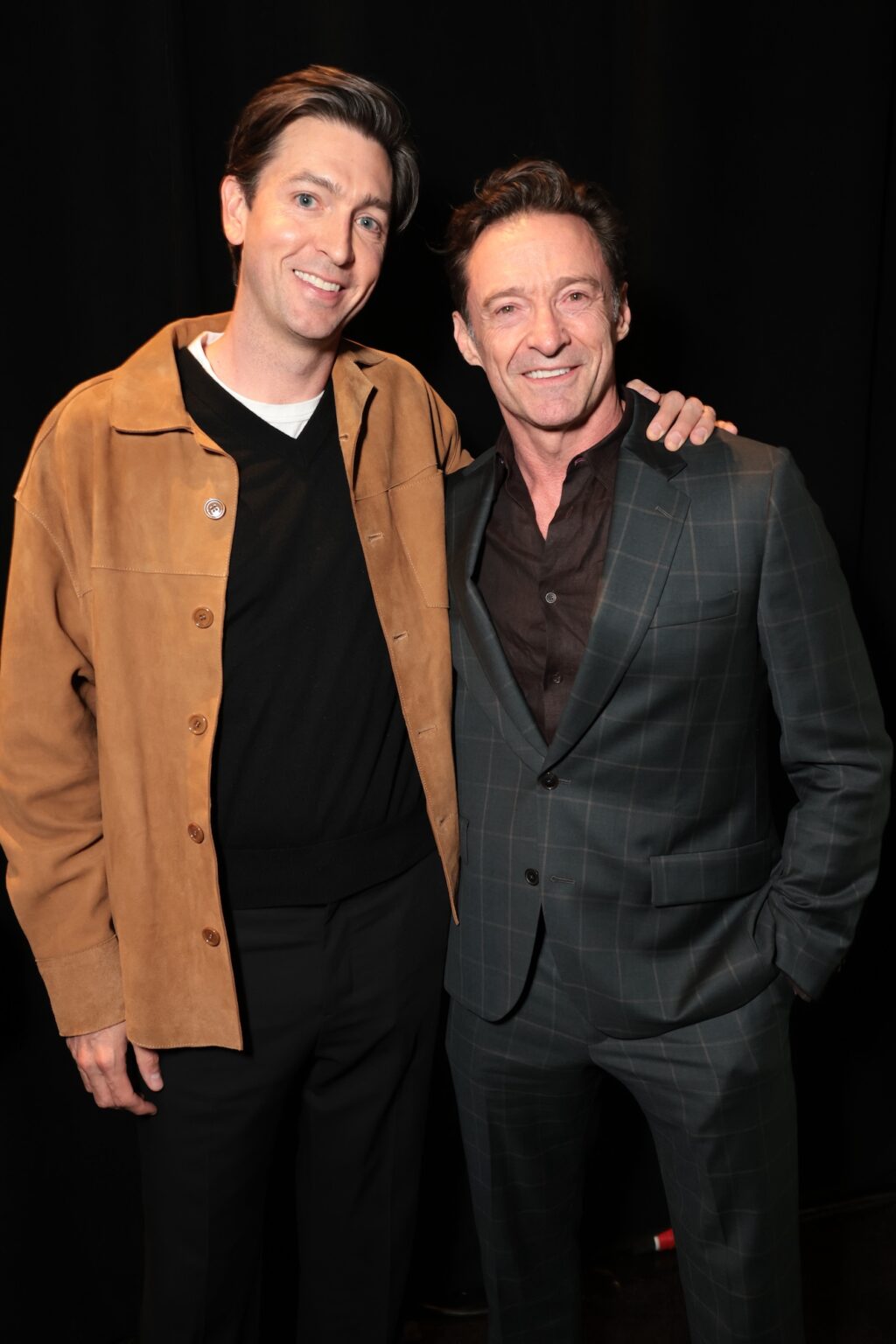 LAS VEGAS, NEVADA - APRIL 15: Nicholas Braun (L) and Hugh Jackman from "The Sheep Detectives" at the Amazon MGM Studios' CinemaCon 2026 Presentation at The Colosseum at Caesars Palace on April 15, 2026 in Las Vegas, Nevada. (Photo by Eric Charbonneau/Amazon MGM Studios via Getty Images)