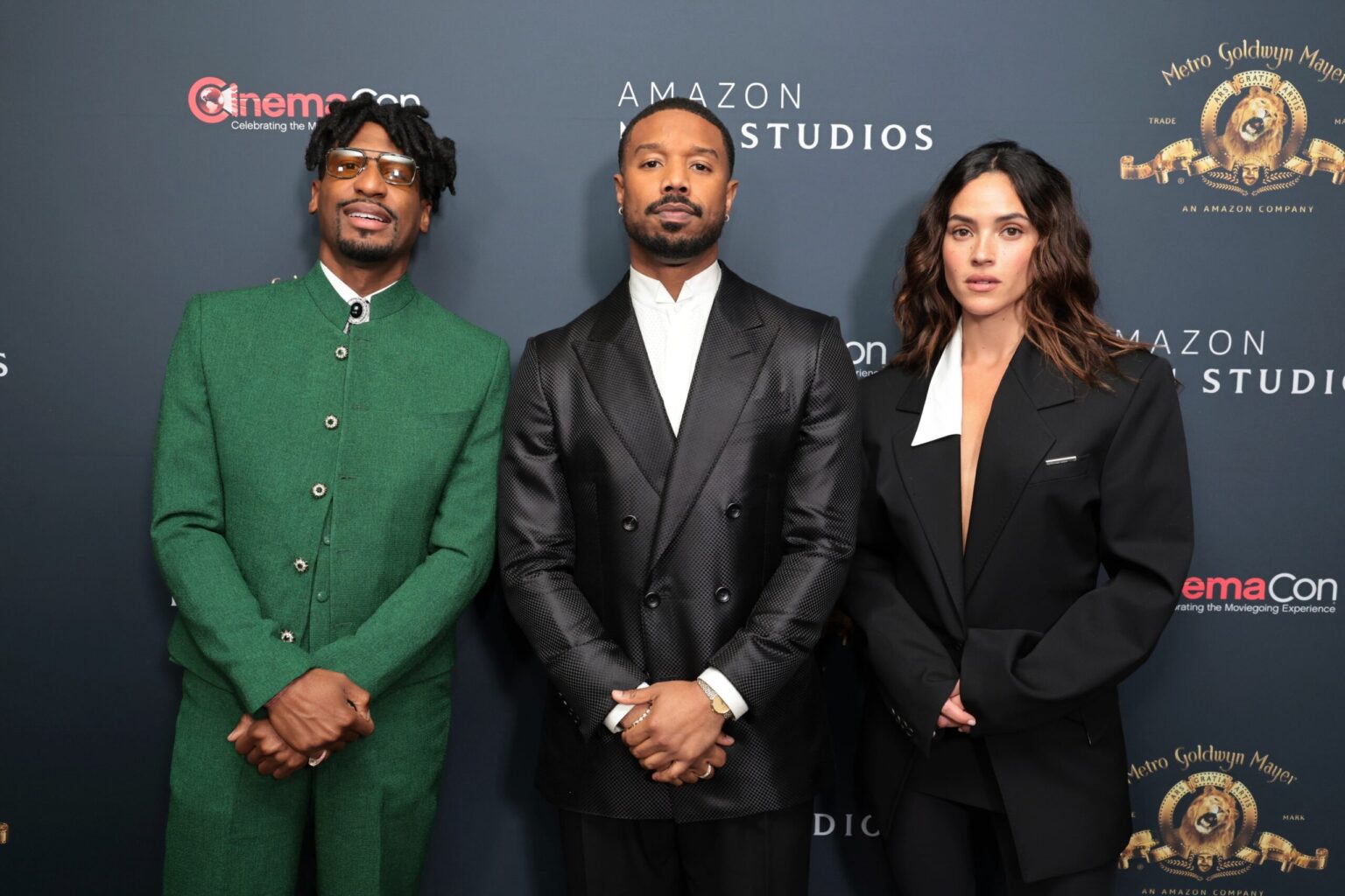 LAS VEGAS, NEVADA - APRIL 15: (L-R) Jon Batiste, Michael B. Jordan and Adria Arjona from "The Thomas Crown Affair" at the Amazon MGM Studios' CinemaCon 2026 Presentation at The Colosseum at Caesars Palace on April 15, 2026 in Las Vegas, Nevada. (Photo by Eric Charbonneau/Amazon MGM Studios via Getty Images)