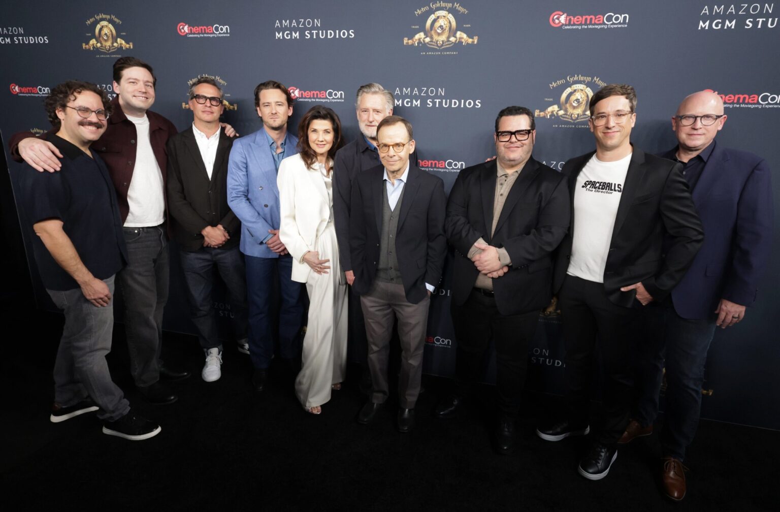 LAS VEGAS, NEVADA - APRIL 15: (L-R) Dan Hernandez, Benji Samit, Jeb Brody, Lewis Pullman, Daphne Zuniga, Bill Pullman, Rick Moranis, Josh Gad, Josh Greenbaum and Kevin Salter from "Spaceballs: The New One" at the Amazon MGM Studios' CinemaCon 2026 Presentation at The Colosseum at Caesars Palace on April 15, 2026 in Las Vegas, Nevada. (Photo by Eric Charbonneau/Amazon MGM Studios via Getty Images)