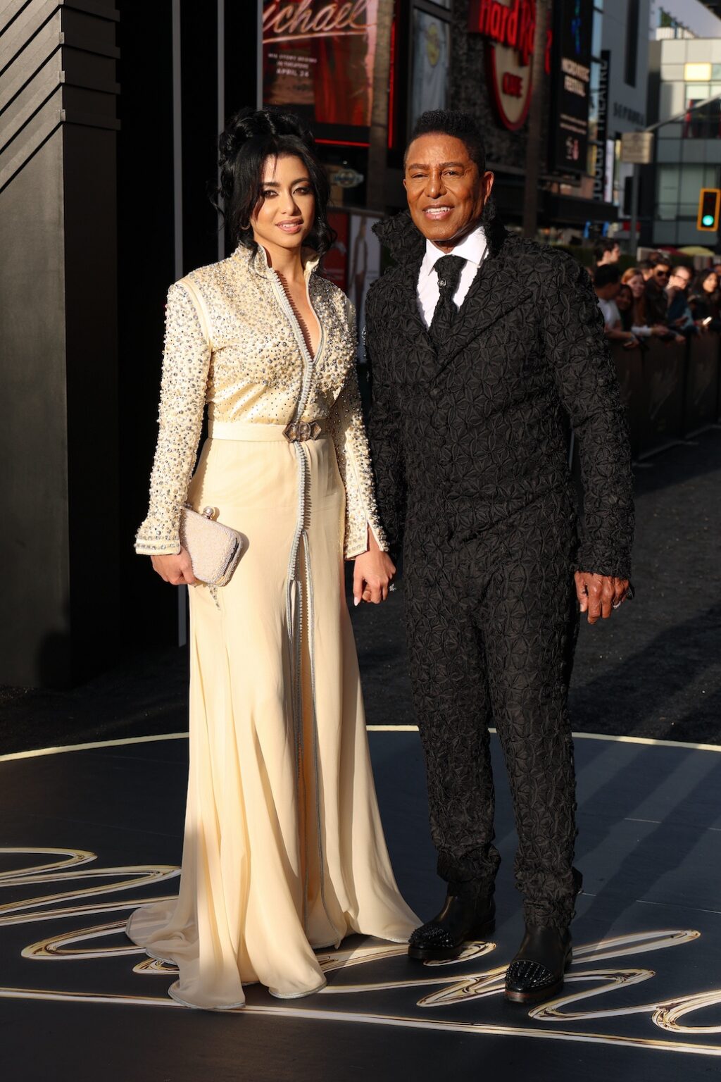 LOS ANGELES, CALIFORNIA - APRIL 20: (L-R) Maday Velazquez and Jermaine Jackson attend Lionsgate's "Michael" Los Angeles premiere at Dolby Theatre on April 20, 2026 in Los Angeles, California. (Photo by Kevin Mazur/Getty Images for Lionsgate)