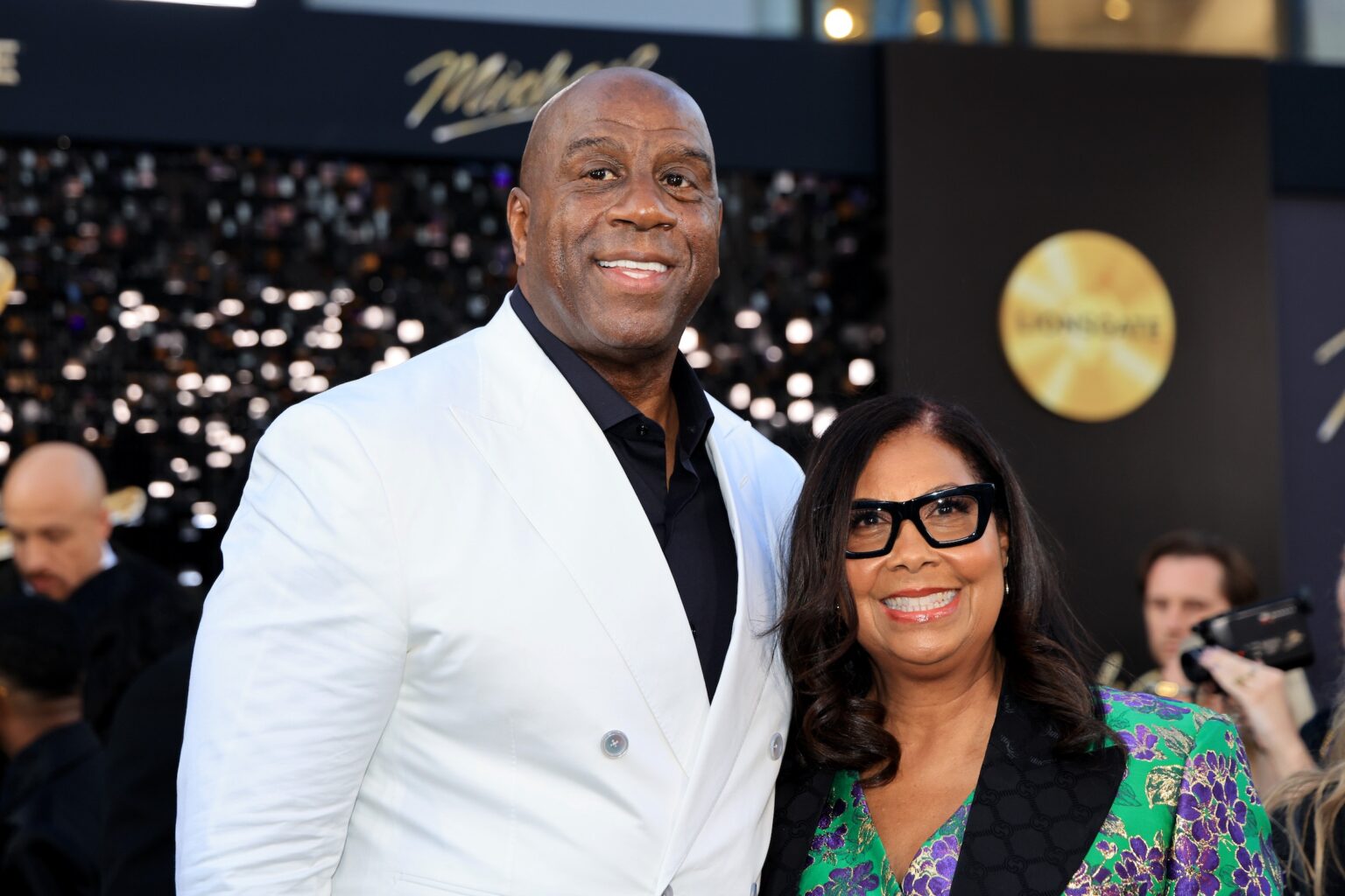 LOS ANGELES, CALIFORNIA - APRIL 20: (L-R) Magic Johnson and Cookie Johnson attend Lionsgate's "Michael" Los Angeles premiere at Dolby Theatre on April 20, 2026 in Los Angeles, California. (Photo by Savion Washington/Getty Images for Lionsgate)
