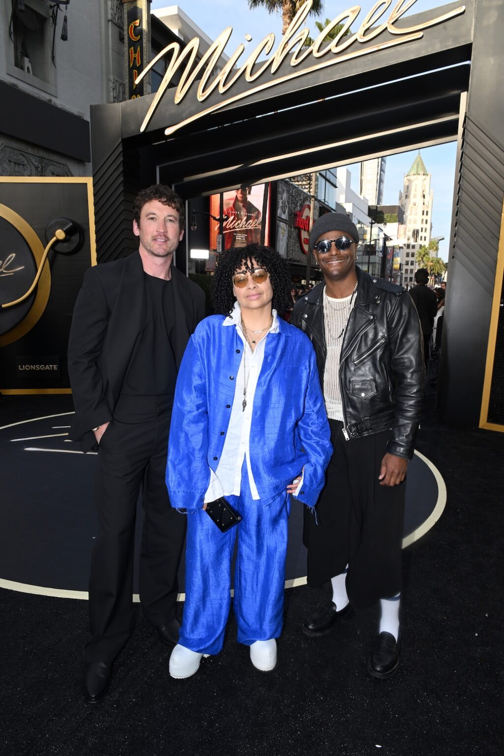 LOS ANGELES, CALIFORNIA - APRIL 20: (L-R) Miles Teller, Raven-Symoné and Austin Brown attend Lionsgate's "Michael" Los Angeles premiere at Dolby Theatre on April 20, 2026 in Los Angeles, California. (Photo by Vivien Killilea/Getty Images for Lionsgate)