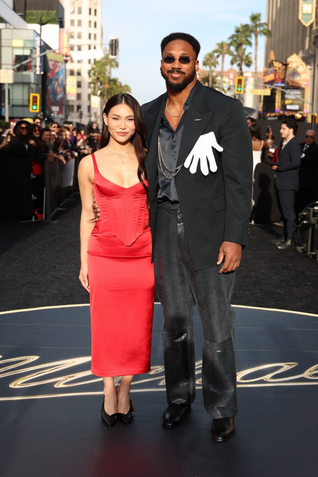 LOS ANGELES, CALIFORNIA - APRIL 20: (L-R) Chloe Kim and Myles Garrett attend Lionsgate's "Michael" Los Angeles premiere at Dolby Theatre on April 20, 2026 in Los Angeles, California. (Photo by Kevin Mazur/Getty Images for Lionsgate)