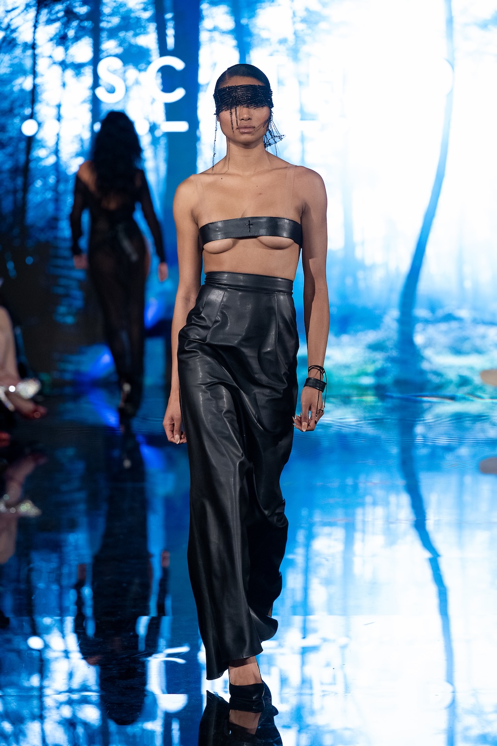 LOS ANGELES, CALIFORNIA - MARCH 13: A model walks the runway at the Scathed Fashion show during Los Angeles Fashion Week Powered By Art Hearts Fashion at The Majestic on March 13, 2026 in Los Angeles, California. (Photo by Mark Gunter/Getty Images for Art Hearts Fashion)