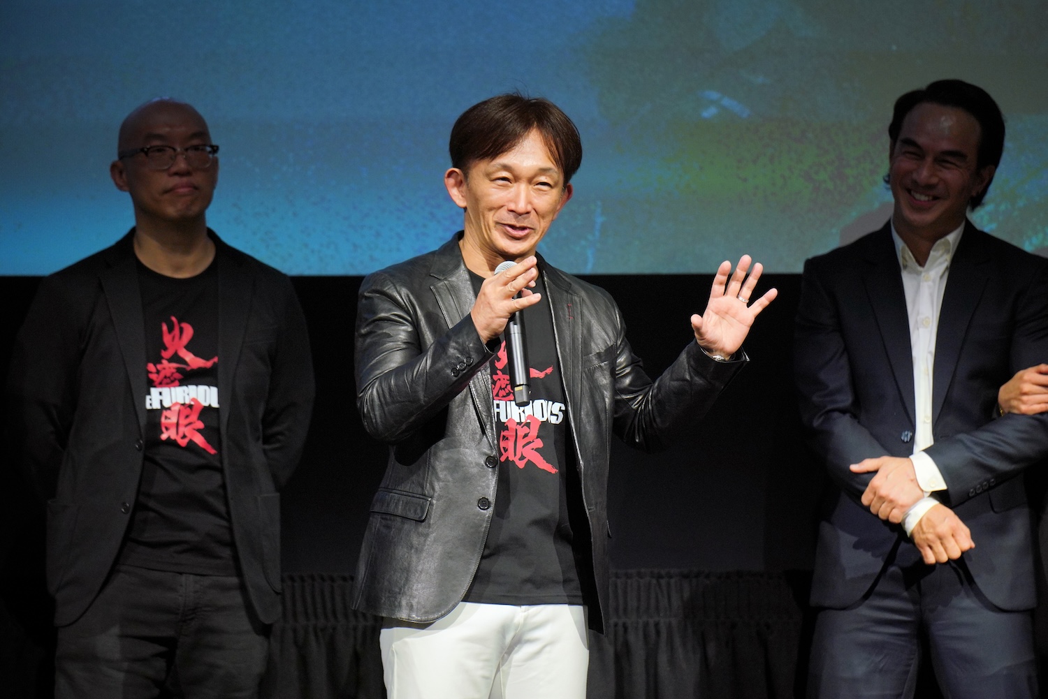 HOLLYWOOD, CALIFORNIA - MAY 28: (L-R) Kenji Tanigaki, Joe Taslim and Xie Miao speak onstage during "The Furious" Special Screening at Hollywood Post 43 - American Legion on May 28, 2026 in Hollywood, California. (Photo by Gonzalo Marroquin/Getty Images for Lionsgate)