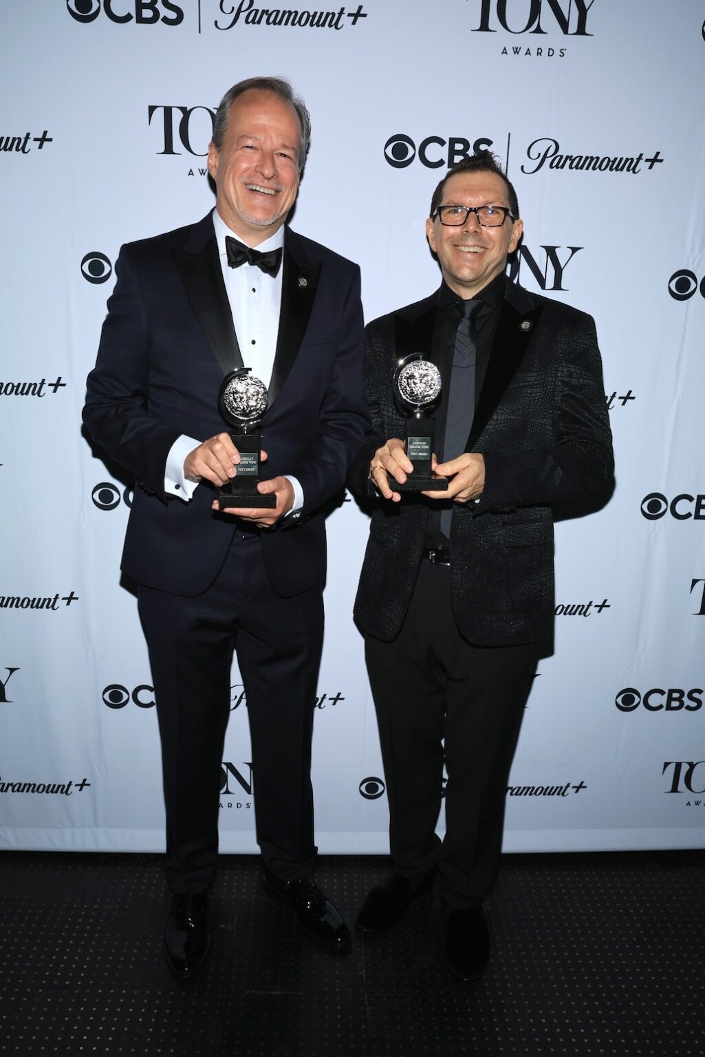 NEW YORK, NEW YORK - JUNE 07: (L-R) Mike Morris and Doug Besterman pose with the Best Orchestrations award for Schmigadoon! backstage during The 79th Annual Tony Awards at Radio City Music Hall on June 07, 2026 in New York City. (Photo by Jemal Countess/Getty Images for Tony Awards Productions)