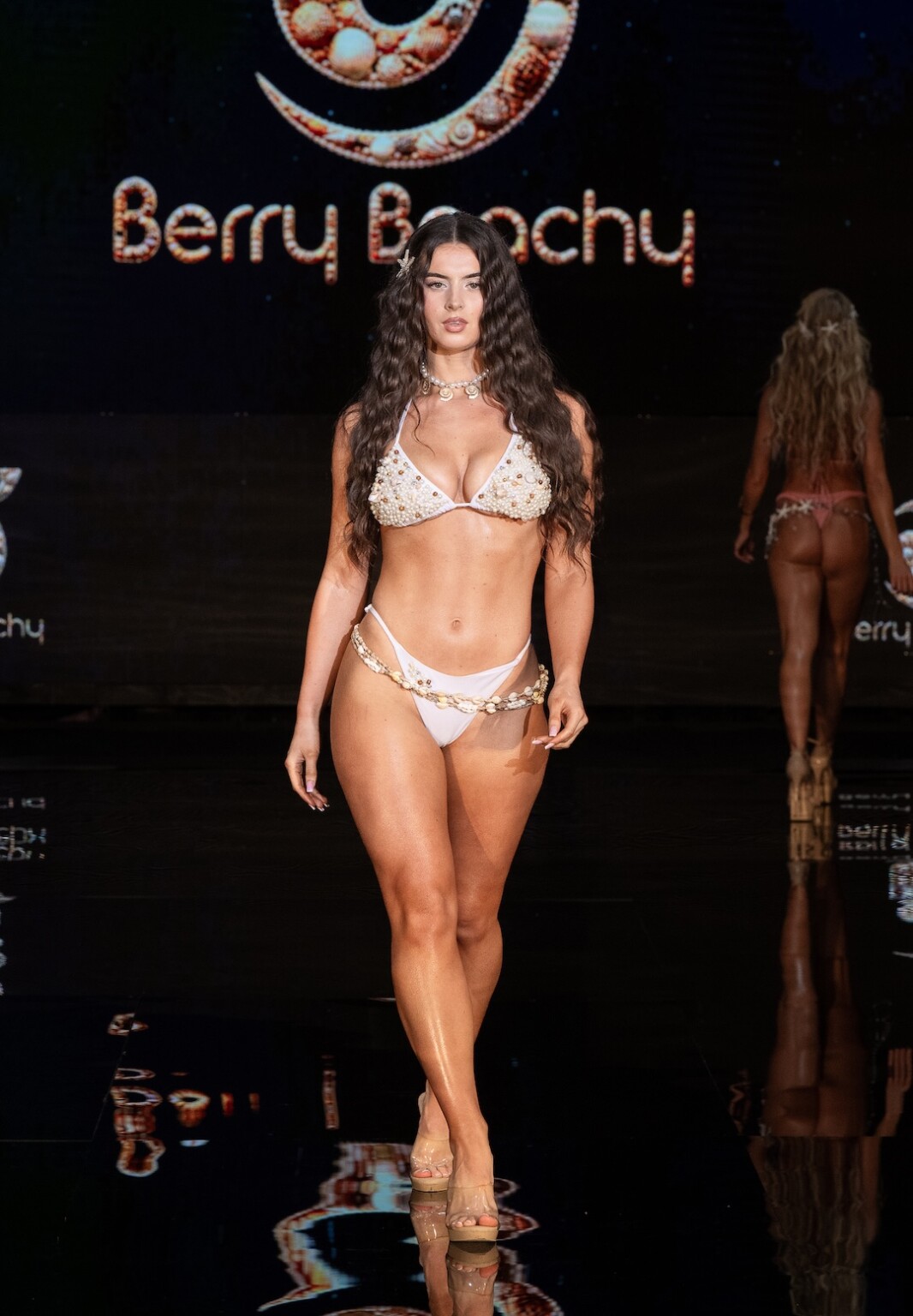 MIAMI, FLORIDA - MAY 28: A model walks the runway at the Berry Beachy Swimwear show during Miami Swim Week Powered By Art Hearts Fashion at M2 MIAMI on May 28, 2026 in Miami, Florida. (Photo by Mark Gunter/Getty Images for Art Hearts Fashion)