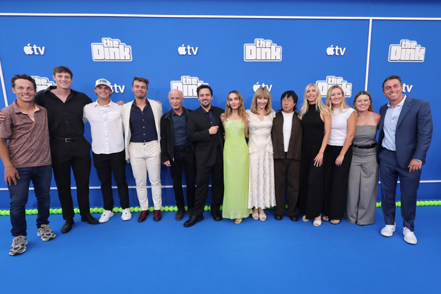 LOS ANGELES, CALIFORNIA - JULY 20: (L-R) Connor Garnett, Roscoe Bellamy, Nick Black, Ben Johns, Ed Harris, Jake Johnson, Chloe Fineman, Mary Steenburgen, Aaron Chen, Meghan Dizon, Maggie Brascia, Mary Brasica and Matt Manasse attend the global premiere of the upcoming Apple TV sports comedy “The Dink” at The Atrium at Westfield Century City on July 20, 2026 in Los Angeles, California. “The Dink” streams globally on Apple TV on Friday, July 24, 2026. (Photo by Eric Charbonneau/Apple TV via Getty Images)
