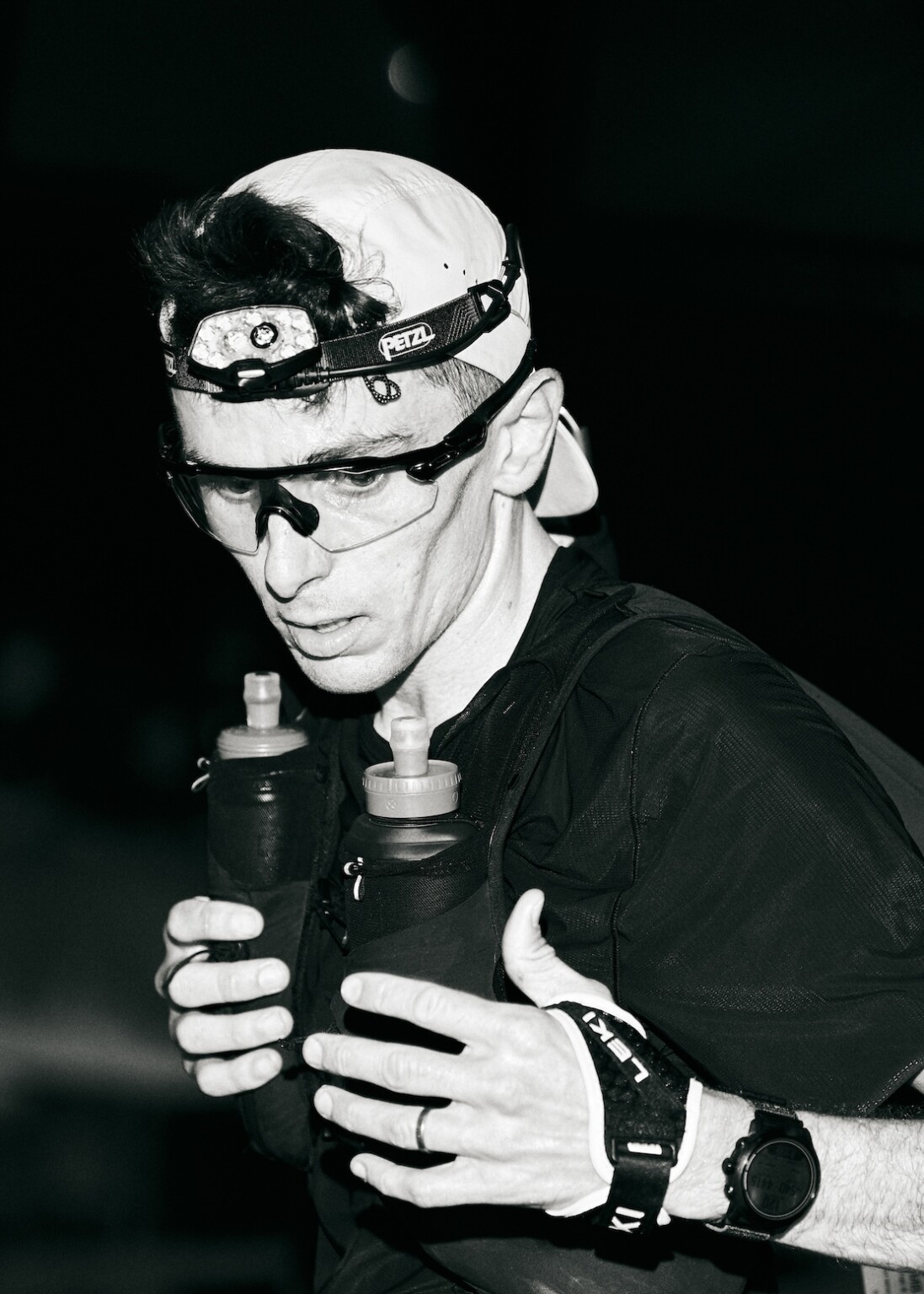 Vincent Bouillard stopping at an aid station while racing UTMB as documented in LEARNING TO FLY. Photo Credit: Aisha McAdams