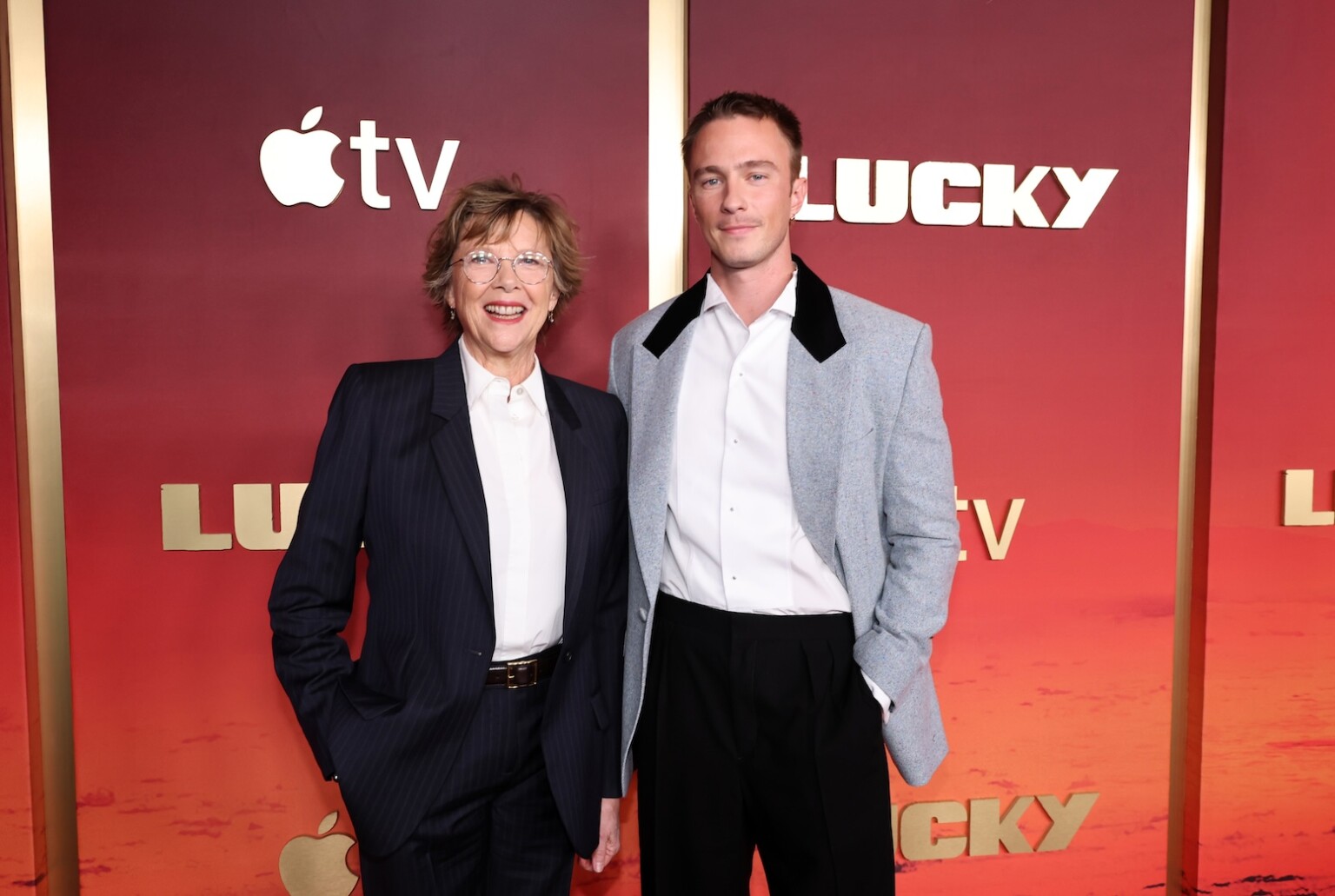 LOS ANGELES, CALIFORNIA - JULY 13: Annette Bening (L) and Drew Starkey attends the global premiere of the upcoming Apple TV series “Lucky” at the Directors Guild of America on July 13, 2026 in Los Angeles, California. The series debuts globally on Apple TV on Wednesday, July 15, 2026. (Photo by Eric Charbonneau/Apple TV via Getty Images)