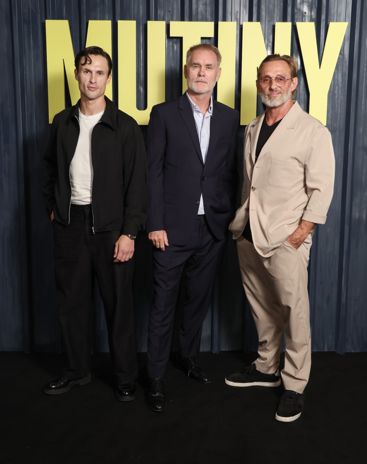 LONDON, ENGLAND - AUGUST 17: Arnas Fedaravičius, Jean Francois Richet and Roland Møller attend a special screening of "Mutiny" at The Cinema In The Power Station on August 17, 2026 in London, England. "Mutiny" is coming to UK cinemas on the 21st August. (Photo by Mike Marsland/Getty Images for Sky UK)