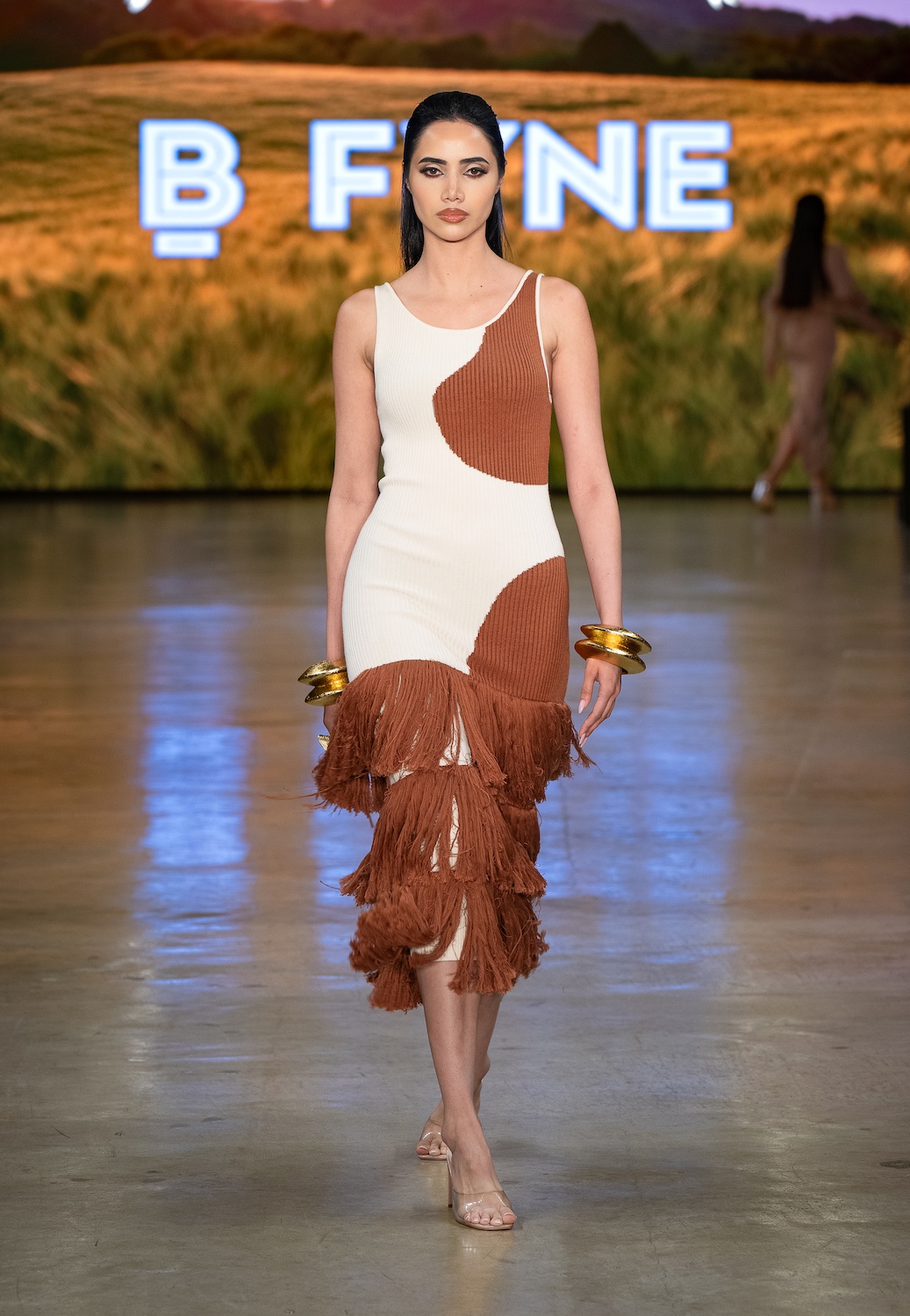LOS ANGELES, CALIFORNIA - OCTOBER 18: A model walks the runway at the BFYNE show during Los Angeles Fashion Week Powered By Art Hearts Fashion at The New Mart on October 18, 2025 in Los Angeles, California. (Photo by Mark Gunter/Getty Images for Art Hearts Fashion)