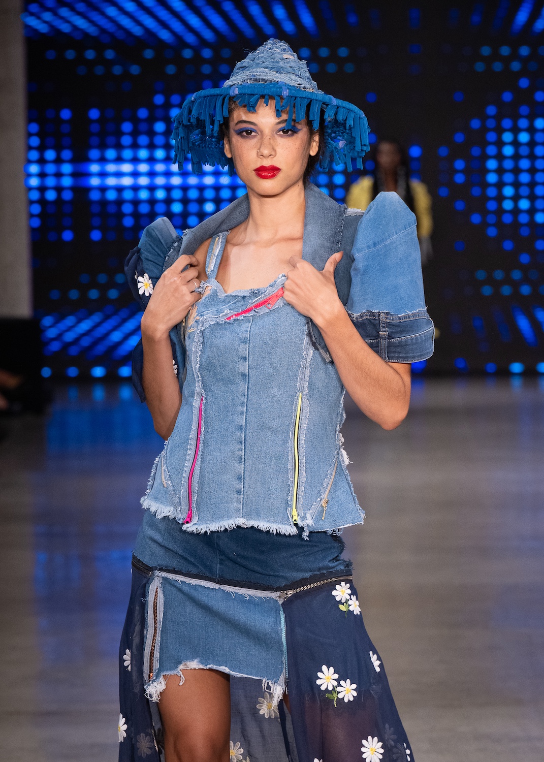 LOS ANGELES, CALIFORNIA - OCTOBER 18: A model walks the runway at the Upcycle Denim & Sustainability Project 2025 show during Los Angeles Fashion Week Powered By Art Hearts Fashion at The New Mart on October 18, 2025 in Los Angeles, California. (Photo by Mark Gunter/Getty Images for Art Hearts Fashion)