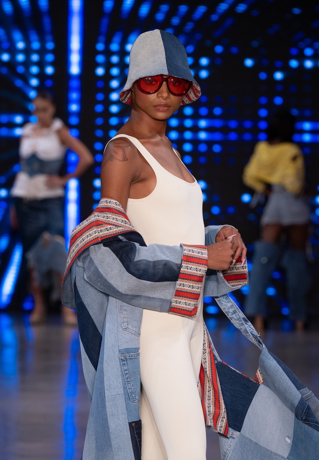 LOS ANGELES, CALIFORNIA - OCTOBER 18: A model walks the runway at the Upcycle Denim & Sustainability Project 2025 show during Los Angeles Fashion Week Powered By Art Hearts Fashion at The New Mart on October 18, 2025 in Los Angeles, California. (Photo by Mark Gunter/Getty Images for Art Hearts Fashion)