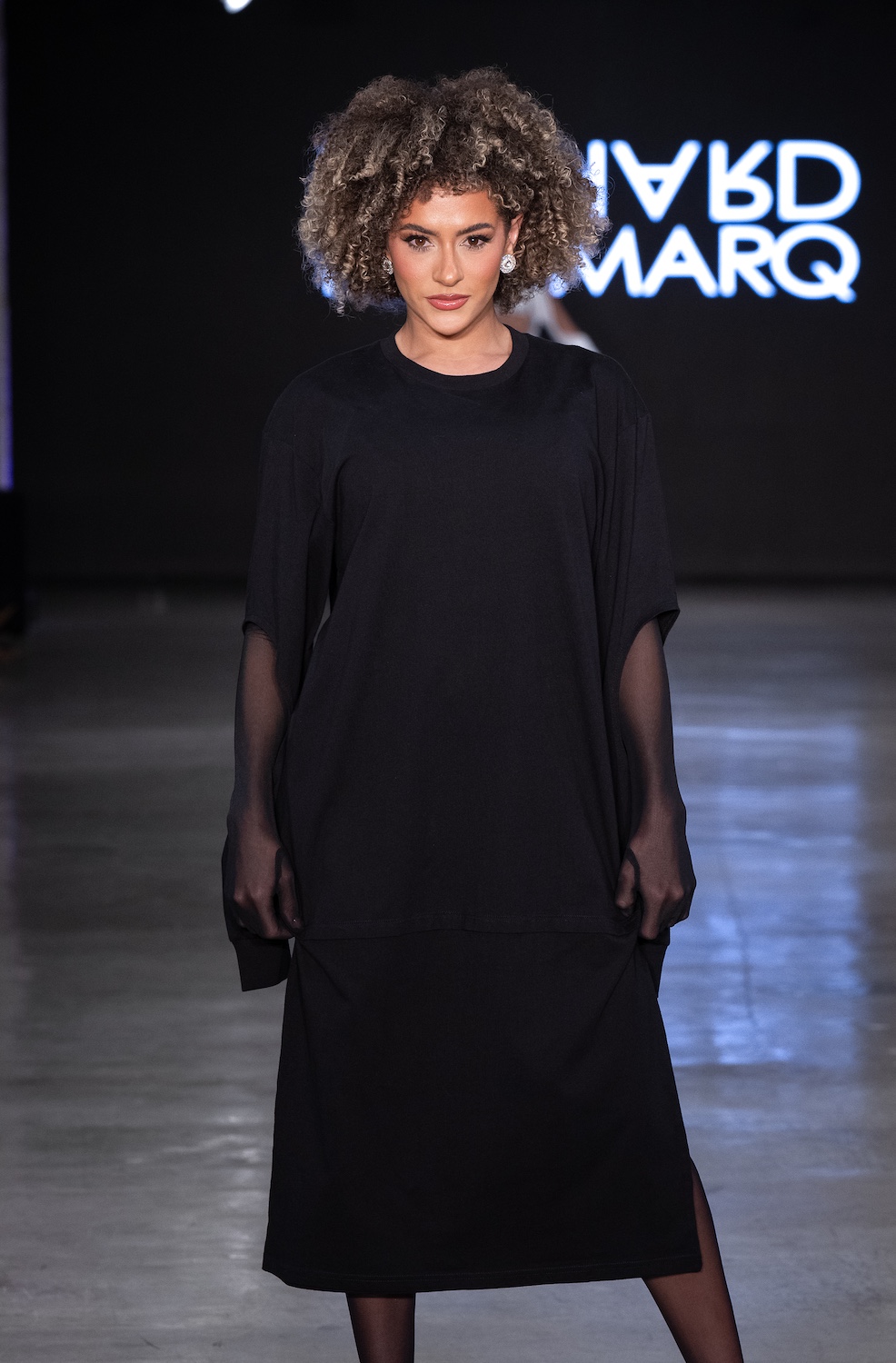 LOS ANGELES, CALIFORNIA - OCTOBER 18: A model walks the runway at the Richard Hallmarq show during Los Angeles Fashion Week Powered By Art Hearts Fashion at The New Mart on October 18, 2025 in Los Angeles, California. (Photo by Mark Gunter/Getty Images for Art Hearts Fashion)
