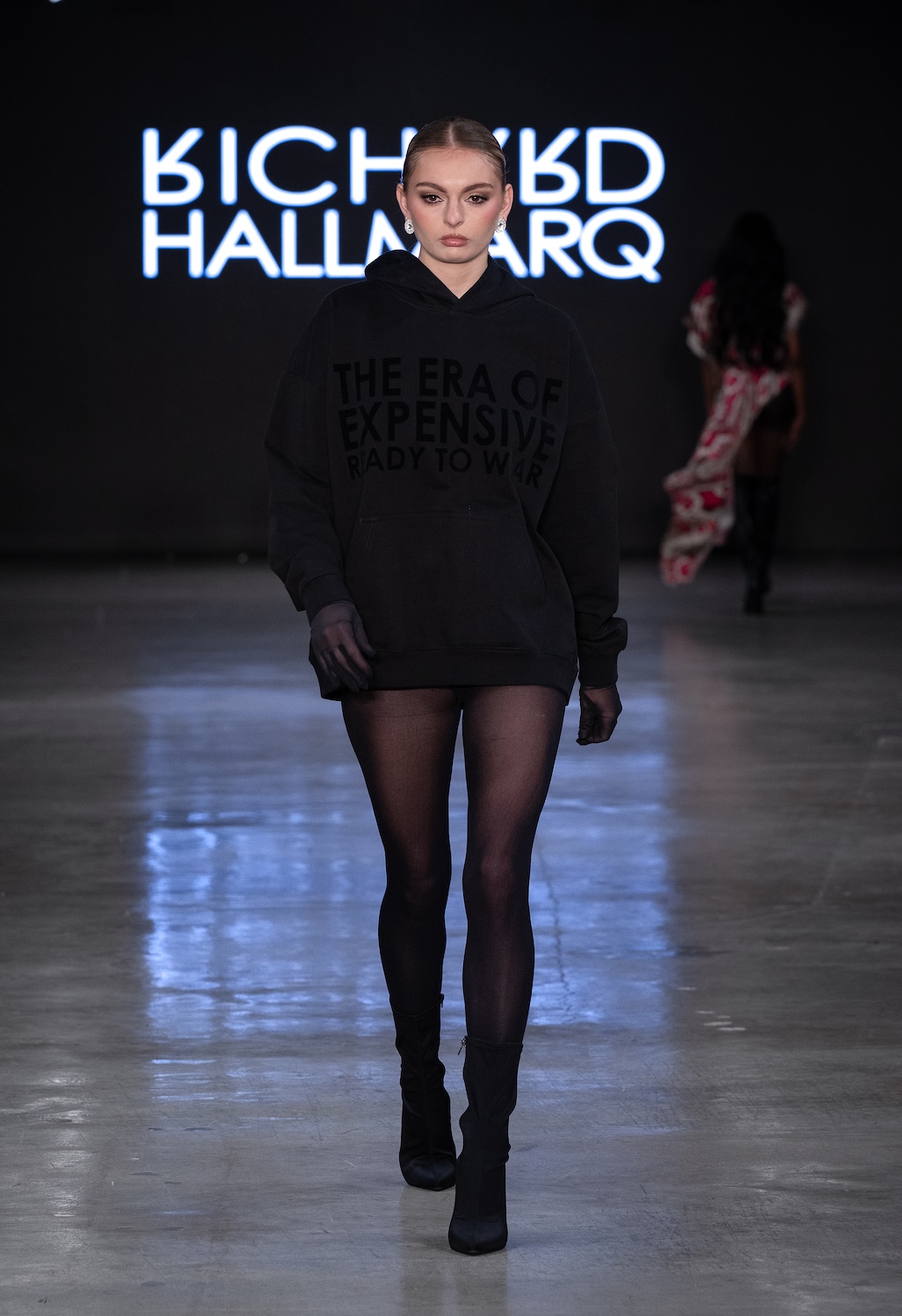 LOS ANGELES, CALIFORNIA - OCTOBER 18: A model walks the runway at the Richard Hallmarq show during Los Angeles Fashion Week Powered By Art Hearts Fashion at The New Mart on October 18, 2025 in Los Angeles, California. (Photo by Mark Gunter/Getty Images for Art Hearts Fashion)