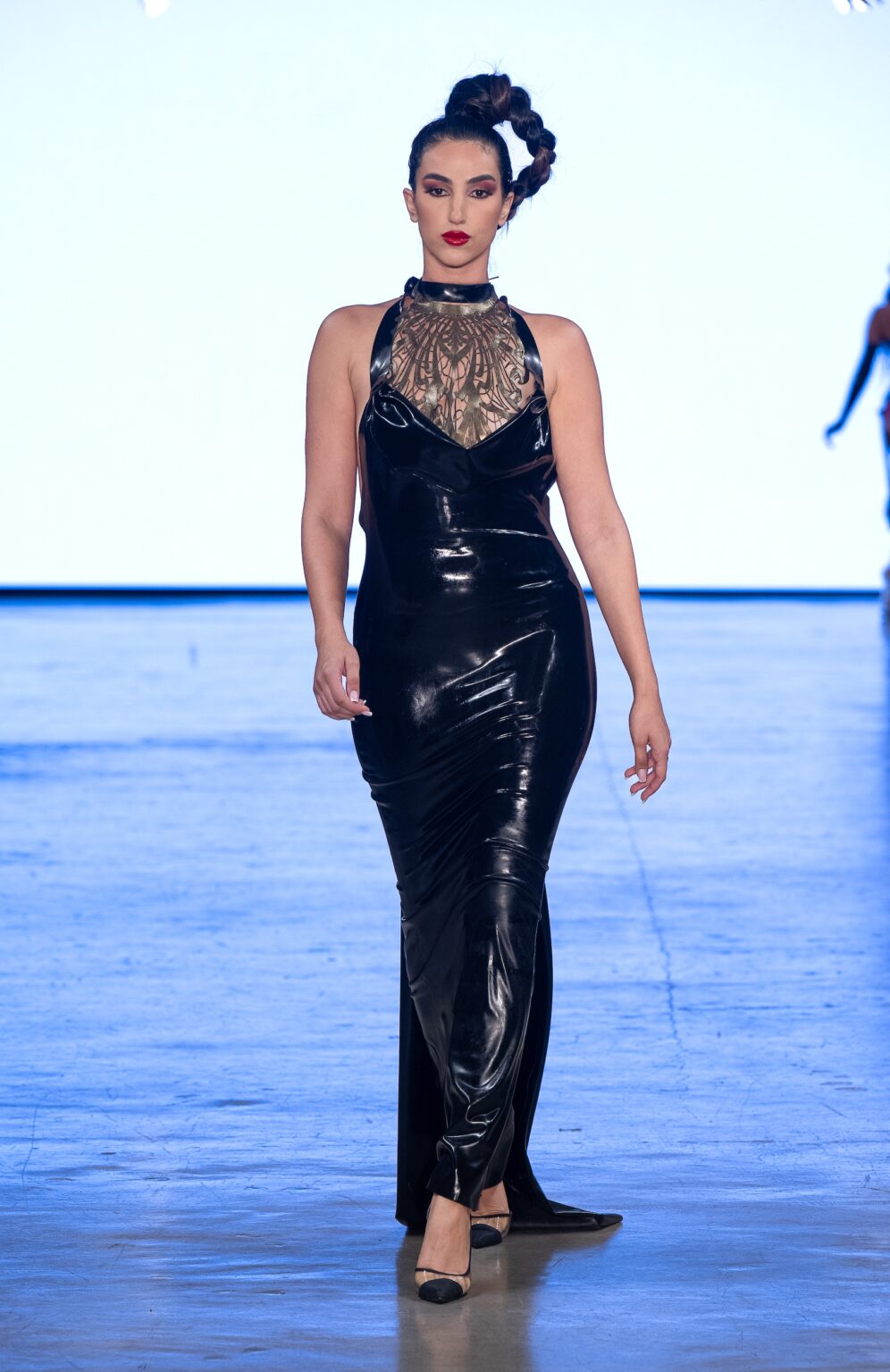 LOS ANGELES, CALIFORNIA - OCTOBER 18: A model walks the runway at the Venus Prototype show during Los Angeles Fashion Week Powered By Art Hearts Fashion at The New Mart on October 18, 2025 in Los Angeles, California. (Photo by Mark Gunter/Getty Images for Art Hearts Fashion)