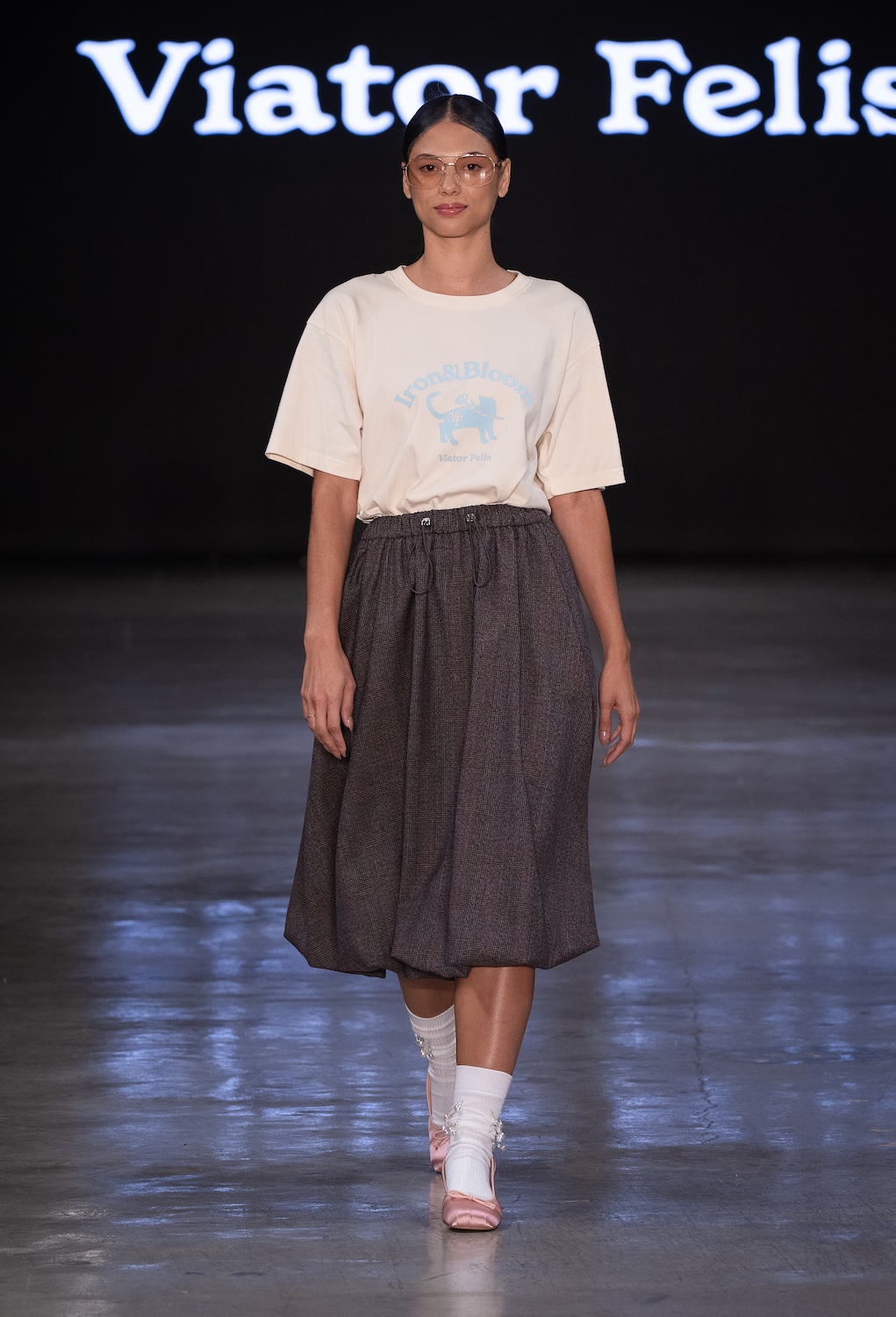 LOS ANGELES, CALIFORNIA - OCTOBER 18: A model walks the runway at the Viator Felis show during Los Angeles Fashion Week Powered By Art Hearts Fashion at The New Mart on October 18, 2025 in Los Angeles, California. (Photo by Mark Gunter/Getty Images for Art Hearts Fashion)