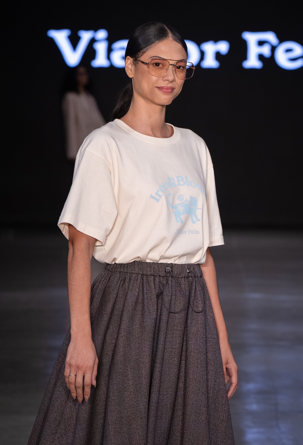 LOS ANGELES, CALIFORNIA - OCTOBER 18: A model walks the runway at the Viator Felis show during Los Angeles Fashion Week Powered By Art Hearts Fashion at The New Mart on October 18, 2025 in Los Angeles, California. (Photo by Mark Gunter/Getty Images for Art Hearts Fashion)